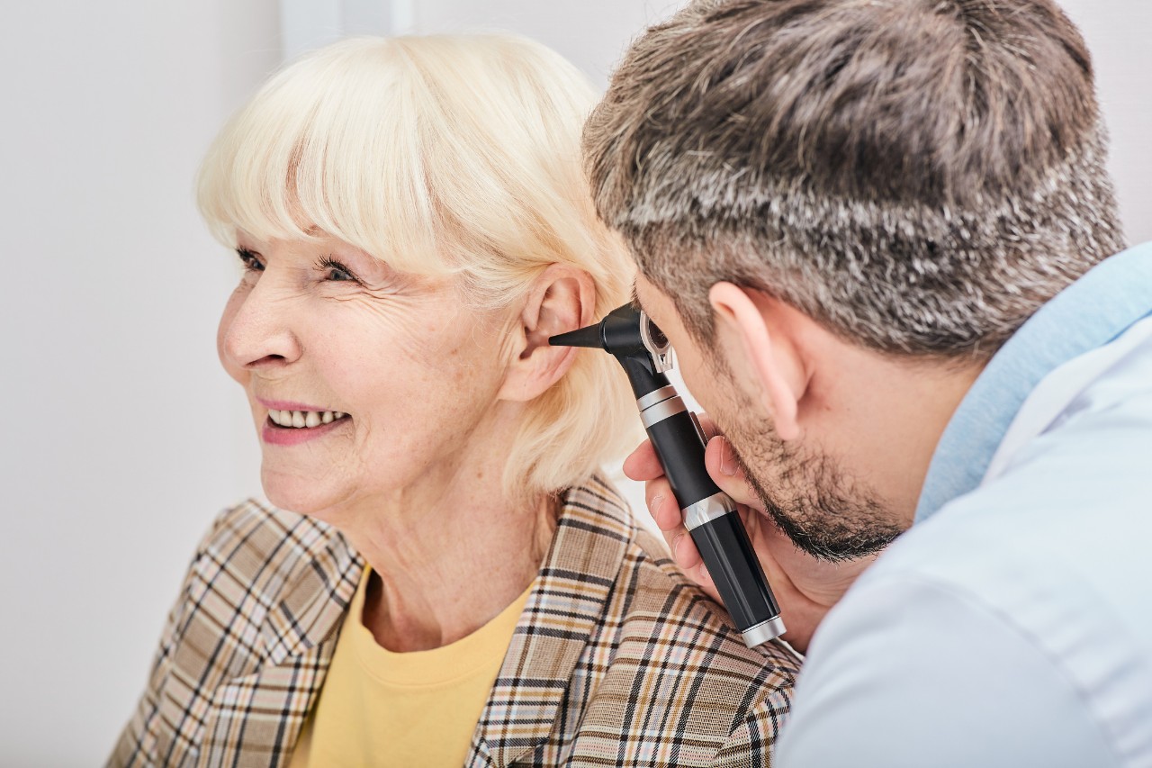 A doctor examining a patient's ear